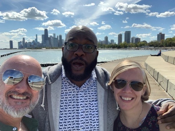 A group of people taking a selfie.