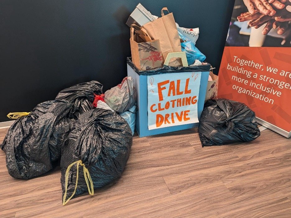 Fall Clothing Drive box overflowing with donations.